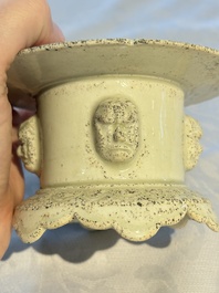 A Chinese qingbai censer with masks in relief, 20th C