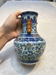 A pair of Chinese doucai 'Hu' vases with lotus scroll design, Qianlong mark, 19th C.