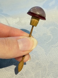 Four Chinese famille rose moulded 'Luohan' snuff bottles, Qianlong marks, 19th C.