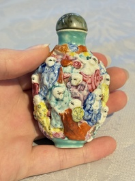 Four Chinese famille rose moulded 'Luohan' snuff bottles, Qianlong marks, 19th C.