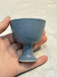 A pair of Chinese blue-glazed 'Hatcher Cargo' vases with incised dragons and a stem cup, Transitional period