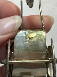 A Chinese enamelled silver model of four bearers and a silver model of a bearer, Guang Sheng Yuan 廣生源 and Yan Ji 衍記 mark, 19th C.