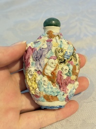 Four Chinese famille rose moulded 'Luohan' snuff bottles, Qianlong marks, 19th C.