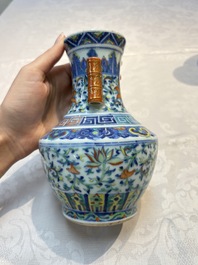 A pair of Chinese doucai 'Hu' vases with lotus scroll design, Qianlong mark, 19th C.