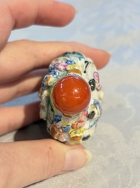 Four Chinese famille rose moulded 'Luohan' snuff bottles, Qianlong marks, 19th C.