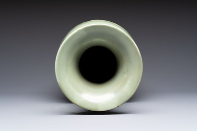 A Chinese celadon-glazed vase with relief lotus scroll design, 18th C.