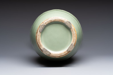 A Chinese celadon-glazed vase with relief lotus scroll design, 18th C.