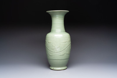 A Chinese celadon-glazed vase with relief lotus scroll design, 18th C.