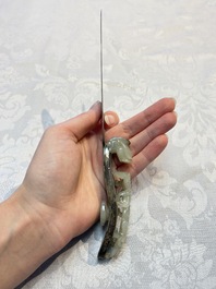 A Chinese mounted magnifying glass with a jade handle and a sterling silver letter opener with a jade handle, 19th C.