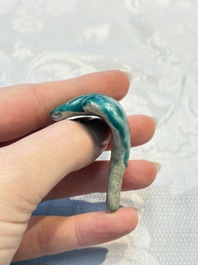 A pair of Chinese famille rose models of a boy riding a qilin and a bitong, 19/20th C.