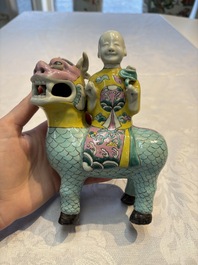 A pair of Chinese famille rose models of a boy riding a qilin and a bitong, 19/20th C.