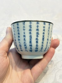 A Chinese blue and white 'Calligraphic' plate, a saucer, a box and a cup for the Thai market, Bao Zhu Li Ji 寶珠利記 and Man Tang Fu Ji 滿堂福記 mark, 19th C.