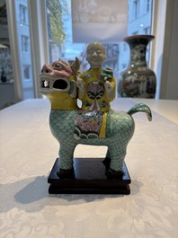 A pair of Chinese famille rose models of a boy riding a qilin and a bitong, 19/20th C.