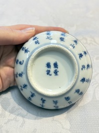 A Chinese blue and white 'Calligraphic' plate, a saucer, a box and a cup for the Thai market, Bao Zhu Li Ji 寶珠利記 and Man Tang Fu Ji 滿堂福記 mark, 19th C.
