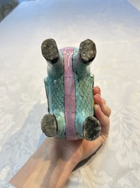 A pair of Chinese famille rose models of a boy riding a qilin and a bitong, 19/20th C.