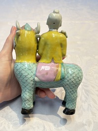 A pair of Chinese famille rose models of a boy riding a qilin and a bitong, 19/20th C.