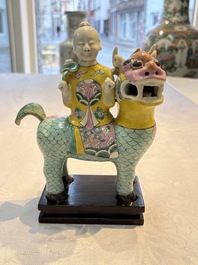A pair of Chinese famille rose models of a boy riding a qilin and a bitong, 19/20th C.