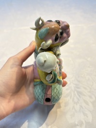 A pair of Chinese famille rose models of a boy riding a qilin and a bitong, 19/20th C.