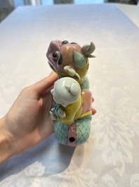 A pair of Chinese famille rose models of a boy riding a qilin and a bitong, 19/20th C.