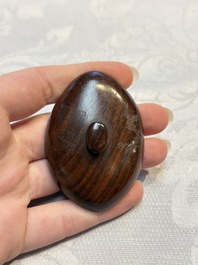 A Chinese famille rose ewer in the form of a dragon and two carps with wooden cover and stand, 19th C.