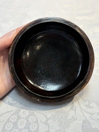 Two Chinese cinnabar lacquer covered boxes and a bottle vase, 19th C.