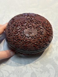 Two Chinese cinnabar lacquer covered boxes and a bottle vase, 19th C.