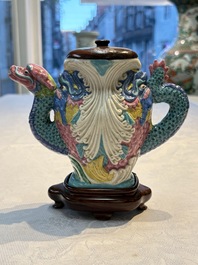 A Chinese famille rose ewer in the form of a dragon and two carps with wooden cover and stand, 19th C.