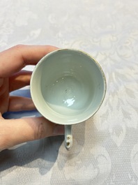 Four sets of Chinese export grisaille and gilt-decorated handled cups and saucers with crowned monograms, Qianlong