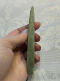 A Chinese celadon jade snuff bottle, a plaque and a ritual stick, Han and later