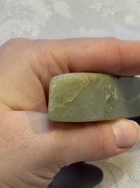 A Chinese celadon jade snuff bottle, a plaque and a ritual stick, Han and later