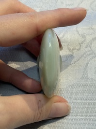 A Chinese celadon jade snuff bottle, a plaque and a ritual stick, Han and later