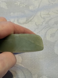 A Chinese celadon jade snuff bottle, a plaque and a ritual stick, Han and later