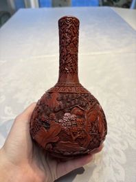 Two Chinese cinnabar lacquer covered boxes and a bottle vase, 19th C.
