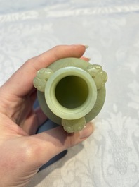 A Chinese celadon jade covered vase, with wooden stand, and a bowl with wooden cover and stand, 19/20th C.