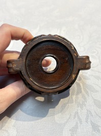 A Chinese celadon jade covered vase, with wooden stand, and a bowl with wooden cover and stand, 19/20th C.