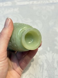 A Chinese celadon jade covered vase, with wooden stand, and a bowl with wooden cover and stand, 19/20th C.