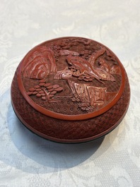 Two Chinese cinnabar lacquer covered boxes and a bottle vase, 19th C.