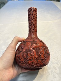 Two Chinese cinnabar lacquer covered boxes and a bottle vase, 19th C.