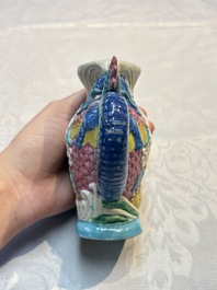 A Chinese famille rose ewer in the form of a dragon and two carps with wooden cover and stand, 19th C.