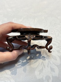 A Chinese celadon jade covered vase, with wooden stand, and a bowl with wooden cover and stand, 19/20th C.
