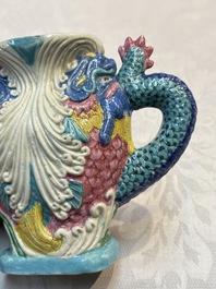 A Chinese famille rose ewer in the form of a dragon and two carps with wooden cover and stand, 19th C.