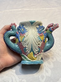 A Chinese famille rose ewer in the form of a dragon and two carps with wooden cover and stand, 19th C.