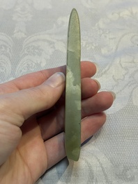 A Chinese celadon jade snuff bottle, a plaque and a ritual stick, Han and later