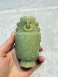 A Chinese celadon jade covered vase, with wooden stand, and a bowl with wooden cover and stand, 19/20th C.