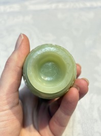 A Chinese celadon jade covered vase, with wooden stand, and a bowl with wooden cover and stand, 19/20th C.