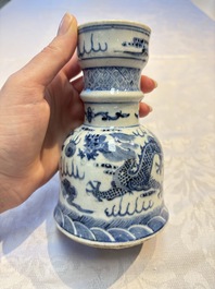 A pair of Chinese blue and white 'Dragons Chasing the Flaming Pearl&rsquo; candlesticks, 19th C.