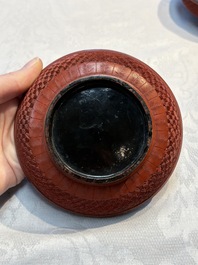 Two Chinese cinnabar lacquer covered boxes and a bottle vase, 19th C.