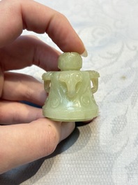 A Chinese celadon jade covered vase, with wooden stand, and a bowl with wooden cover and stand, 19/20th C.