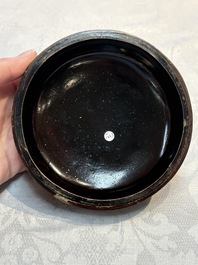 Two Chinese cinnabar lacquer covered boxes and a bottle vase, 19th C.
