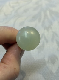 A Chinese celadon jade snuff bottle, a plaque and a ritual stick, Han and later